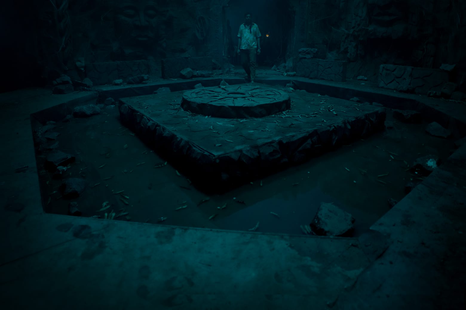 The altar of the kund — a man with a torch
